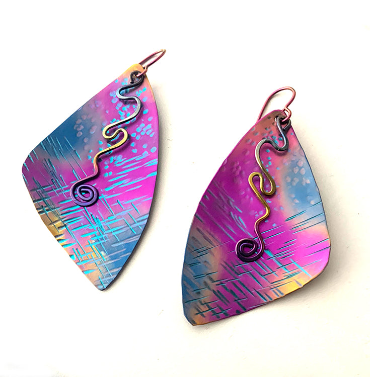 fuchsia, blue, and gold textured large niobium earrings with rainbow anodized squiggle dangles